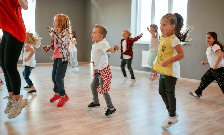 group of little boys and girls dancing while having class