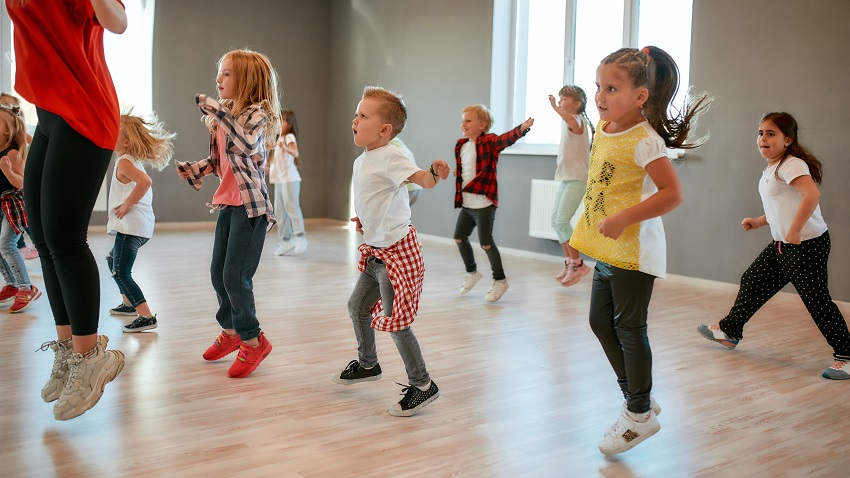 group of little boys and girls dancing while having class